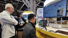 A person using PanopticAI's mobile application in a showcase in Hong Kong