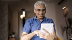 Man looking at tablet computer