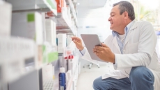 Pharmacist checking inventory