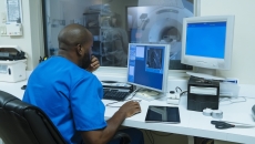 Healthcare professional looking at MRI data