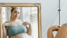 A person looking at their reflection in a mirror