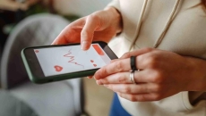 A person looking at data on a smart phone