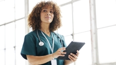 Healthcare provider holding a tablet
