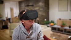A man using an AppliedVR headset at home.