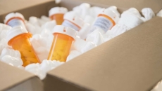 Prescription drug bottles in a box