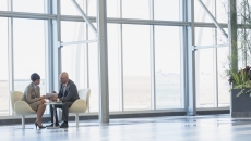 Two executives conferring