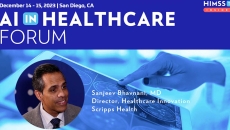 Dr. Sanjeev Bhavnani at Scripps Health_Doctor looking at brain scan on tablet photo by katleho Seisa/Getty Images