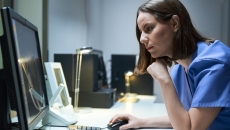 Technician reviewing MRI data