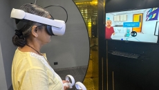 A nurse trying out a VR simulator at the Virtual Reality Health Lab in KD Hospital