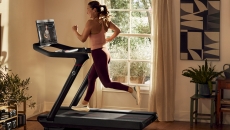 A person exercising on a Peloton treadmill