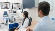 Clinicians interacting via interactive TV screens