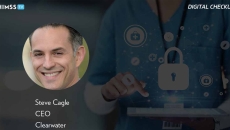 Steve Cagle at Clearwater_Doctor using tablet with holograms photo by PeopleImages/iStock/Getty Images Plus