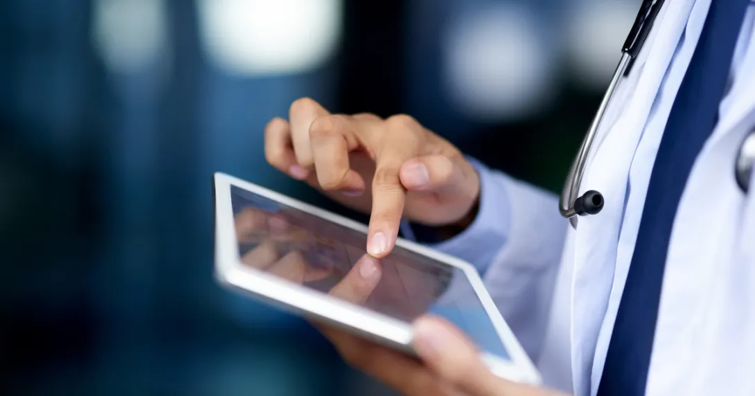 Healthcare professional holding a tablet