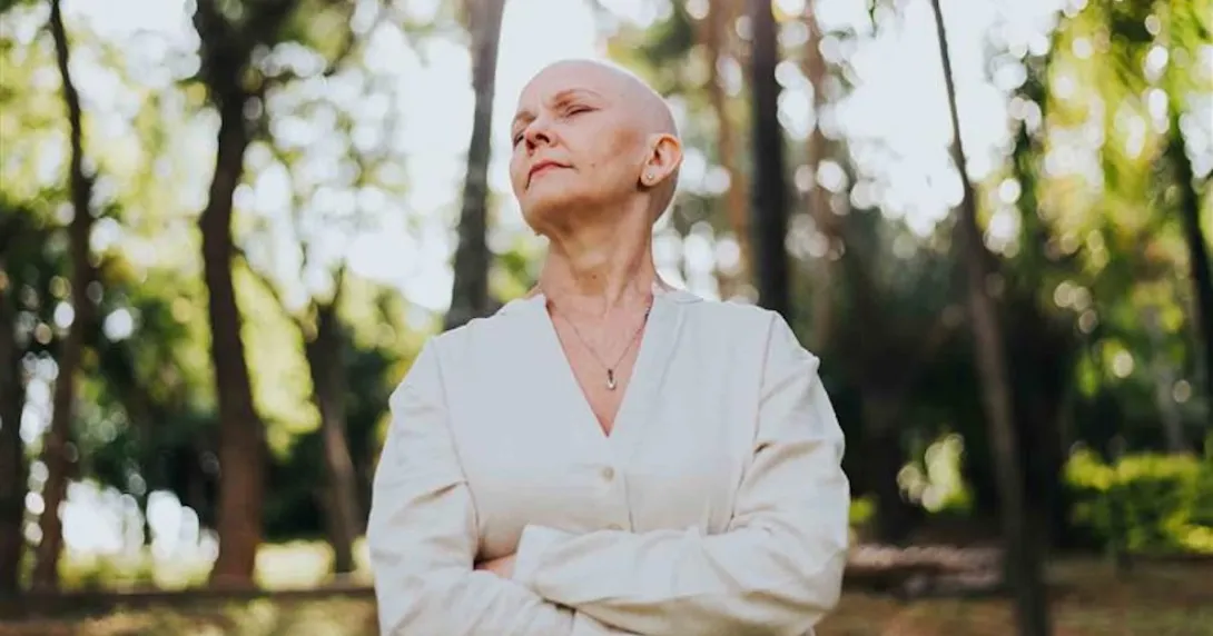 Oncology patient standing in nature