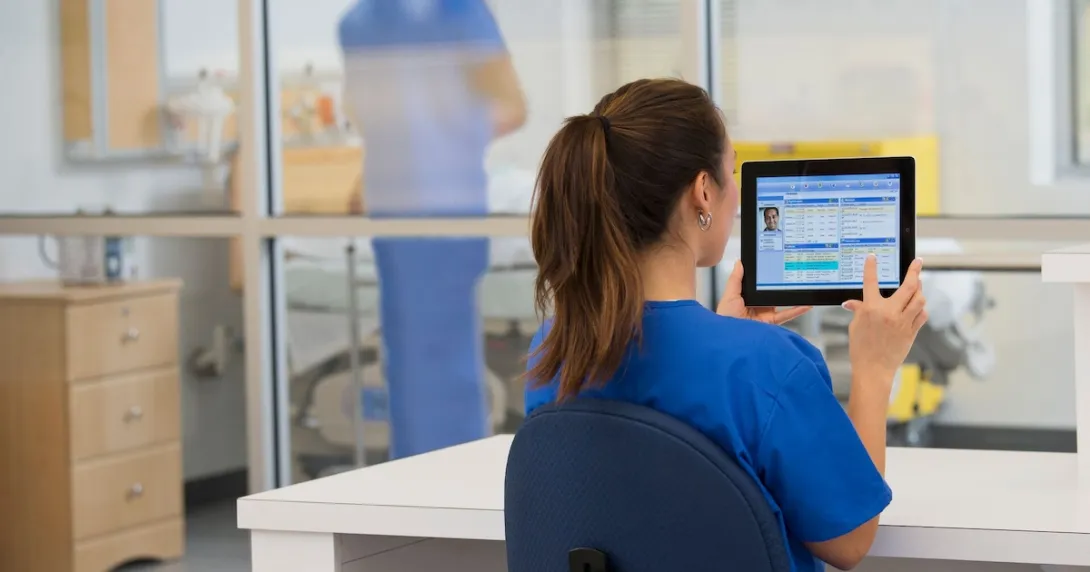 Healthcare provider in the hospital setting looking at a tablet