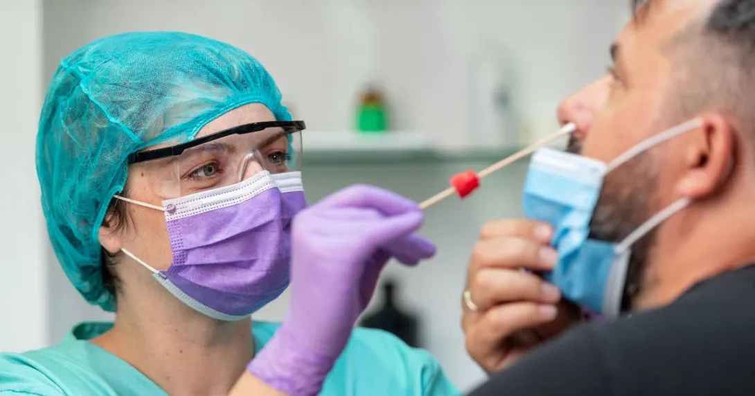 A provider conducting a COVID-19 test.