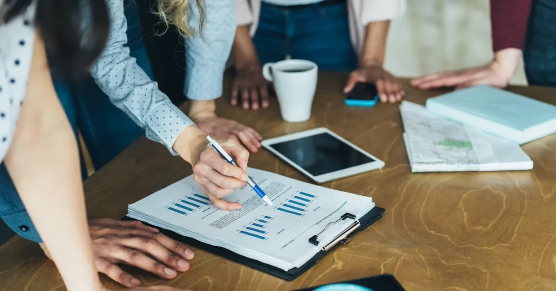 Workers reviewing and analyzing data