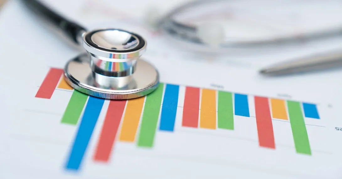 Stethoscope on a colorful financial report