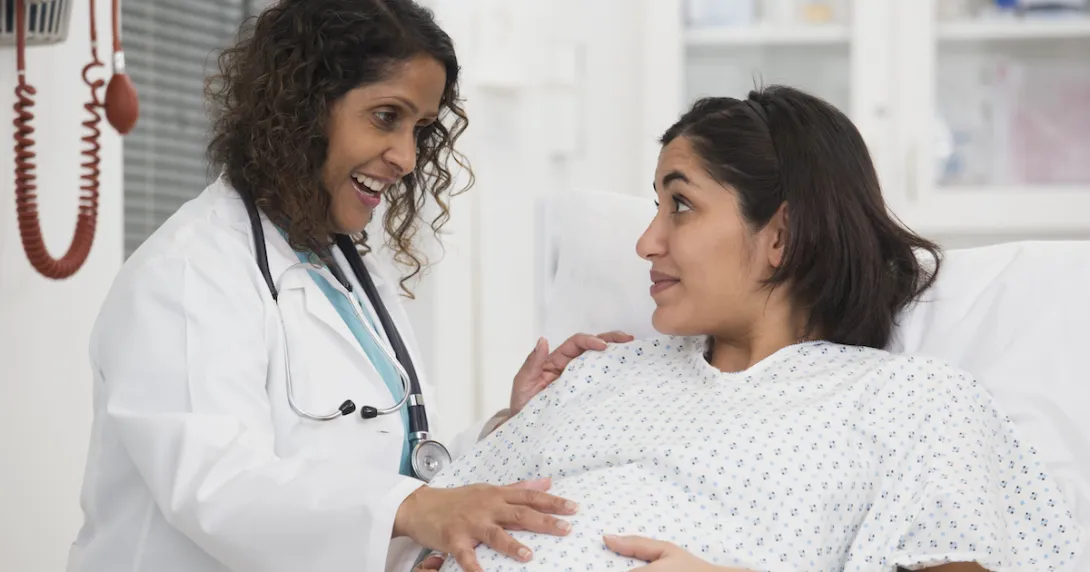 Healthcare provider evaluating a pregnant person