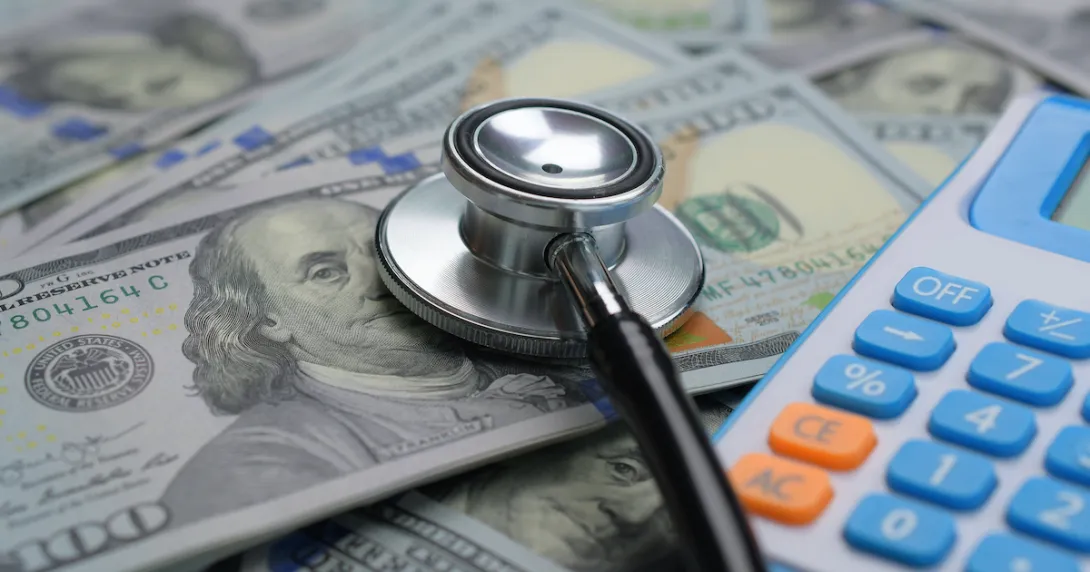 Stethoscope, money and a calculator