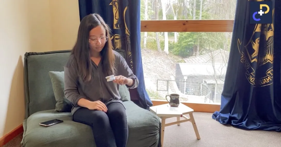 A patient at home using a pulse oximeter