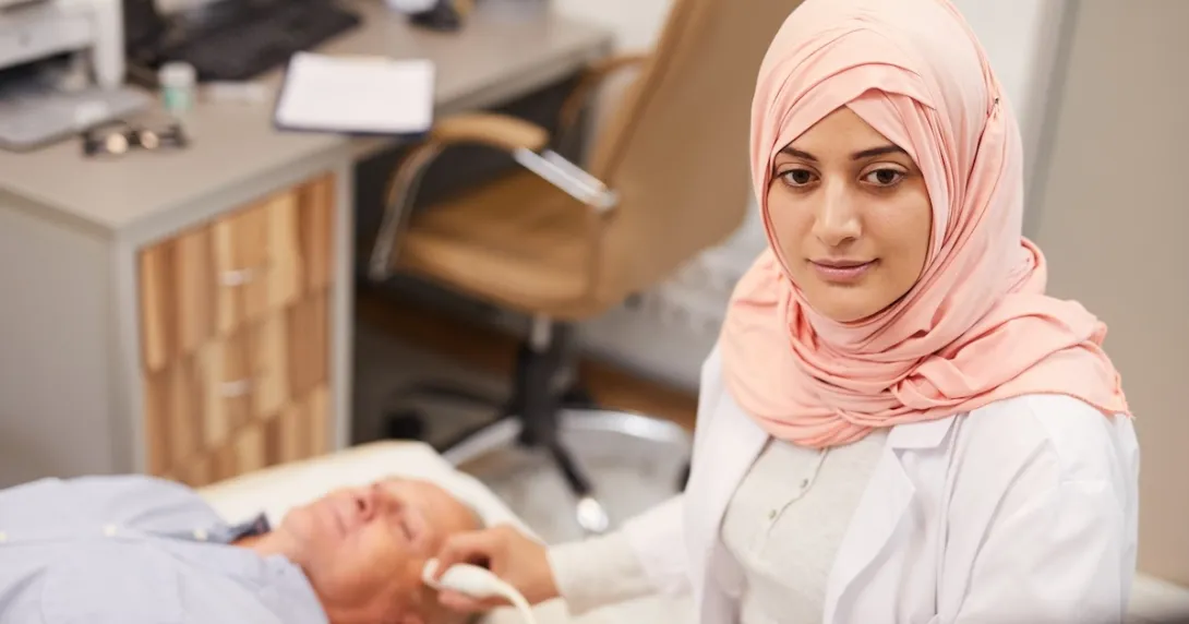 Technician performing ultrasound procedure