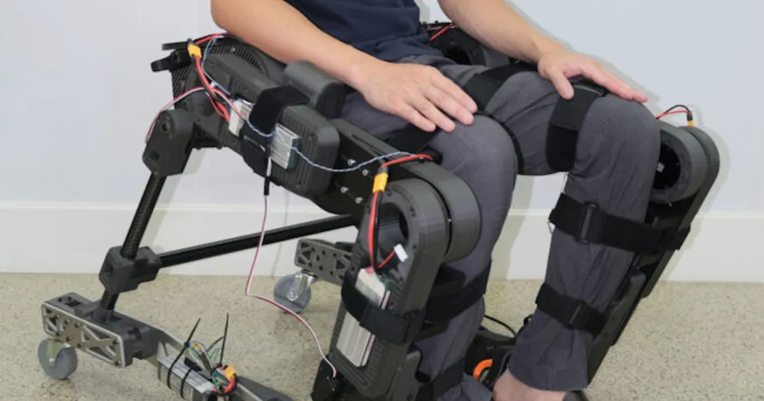 A person wearing the prototype hybrid wheelchair and exoskeleton