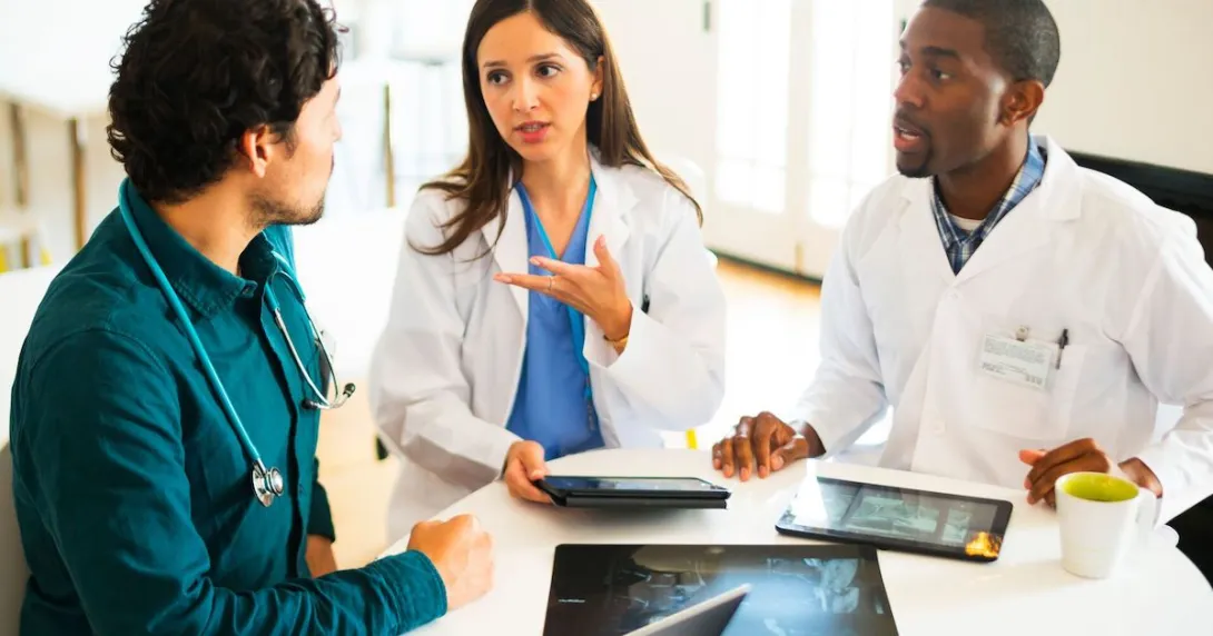 People sitting together looking at devices