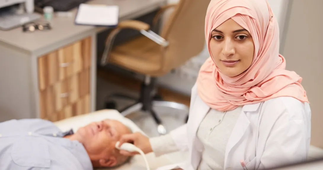 Healthcare professional performing an ultrasound on a patient
